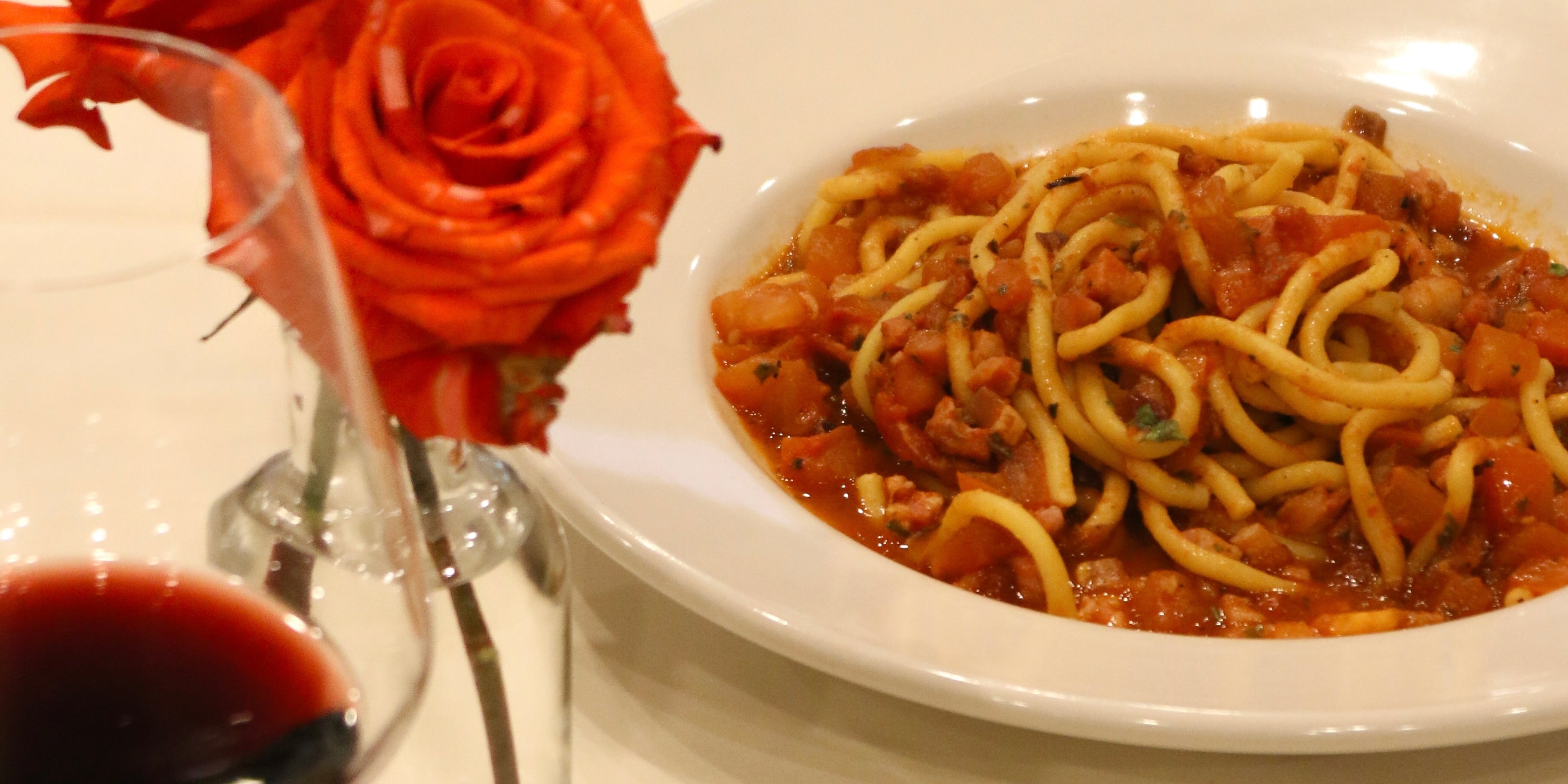 A photo of a plate of pasta with red sauce a favorite dish here at Anacapri